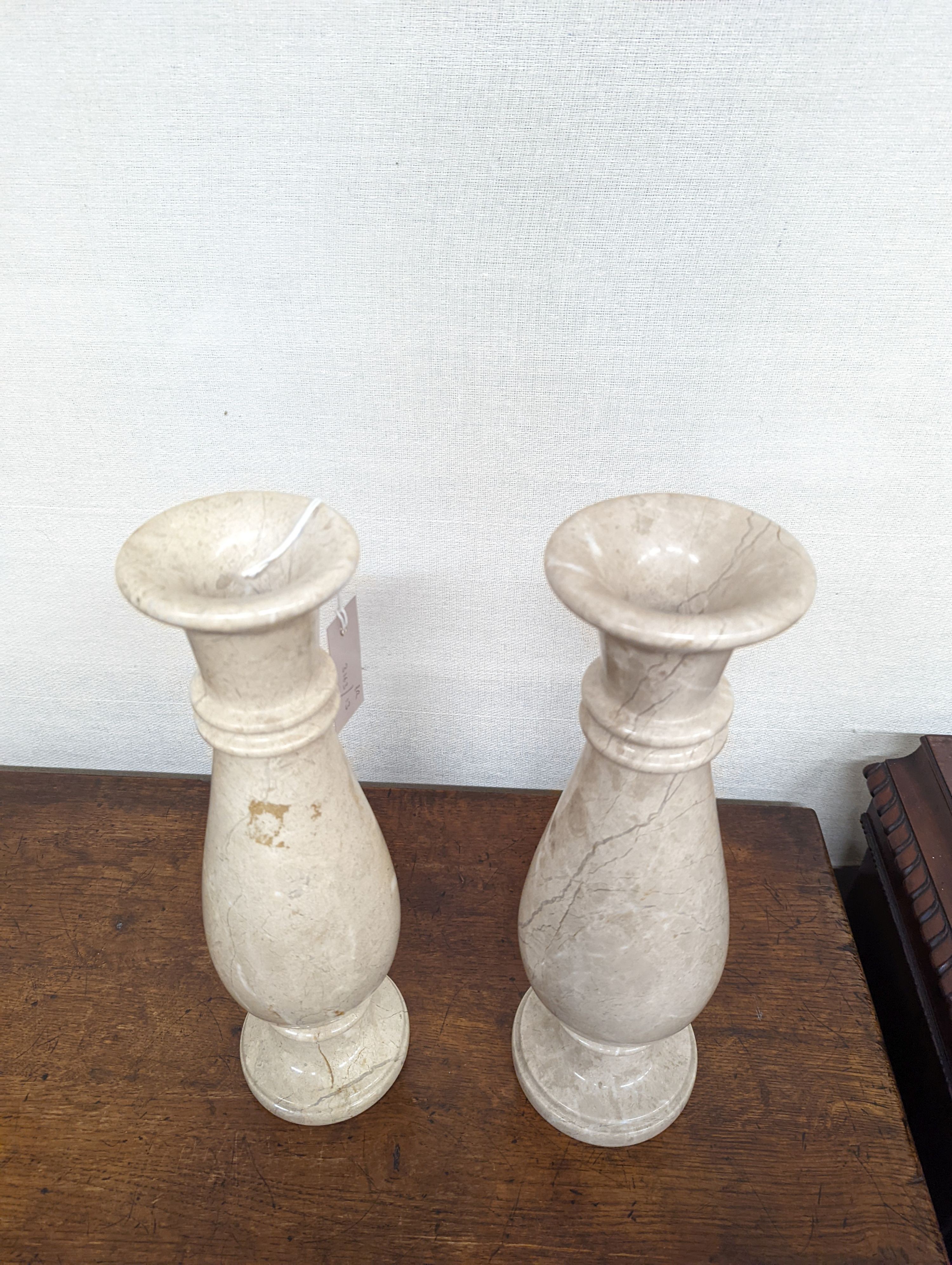 A pair of travertine marble vases. H-40cm.